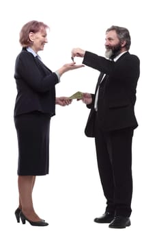 in full growth. businessman handing keys to a business lady . isolated on a white background