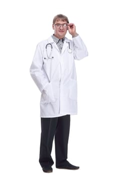 in full growth. experienced male doctor with a stethoscope. isolated on a white background.
