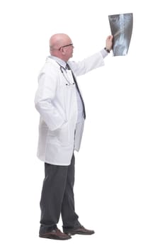 full-length. mature doctor with x-ray .isolated on a white background.