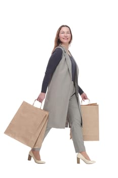 in full growth. elegant woman with shopping bags.isolated on a white background.