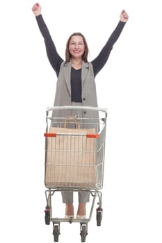 in full growth. elegant woman with a shopping cart.isolated on a white background.