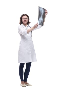 Mature female doctor looking at an x-ray. isolated on a white background.