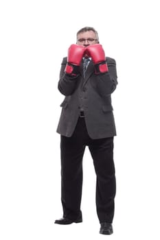 in full growth. business man in red Boxing gloves. isolated on a white background.