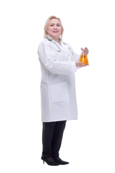Front view of young female scientist working with liquids in laboratory