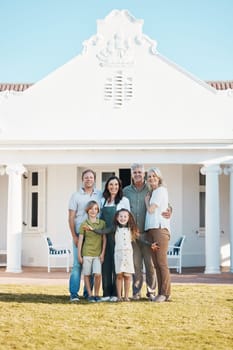 Happy big family, portrait and hug in real estate, new home or property investment on outdoor grass or lawn. Parents, grandparents and kids smile for moving in, house or bonding in happiness together.