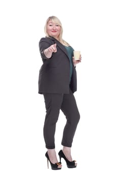 in full growth. tired adult woman with takeaway coffee looking at the camera . isolated on a white background.