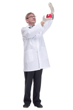 in full growth. laboratory flask with red liquid in the hands of the doctor.isolated on a white background.