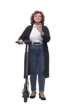 in full growth. modern adult woman with an electric scooter. isolated on a white background