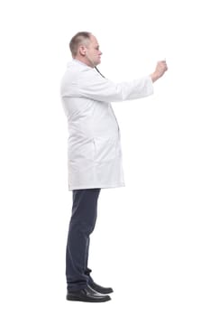 in full growth. serious doctor with a stethoscope in his hands. isolated on a white background.