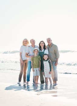 Happy, beach and portrait of family generations together on vacation, holiday or tropical weekend trip. Smile, travel and children with parents and grandparents bonding by the ocean in Australia
