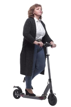 in full growth. confident adult woman with an electric scooter. isolated on a white background