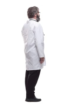 side view. the male doctor is pointing at the white screen. isolated on a white background