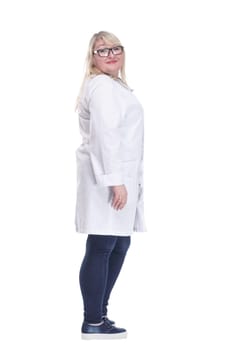 side view. Mature female doctor with a stethoscope looking at a white screen. isolated on a white background.