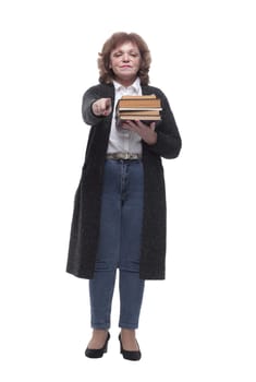 in full growth. a confident woman with a stack of books. isolated on a white background
