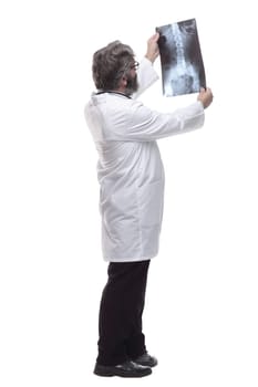side view. attending doctor examining an x-ray of the lungs. isolated on a white background