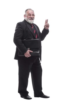 in full growth. smiling business man with a leather briefcase. isolated on a white background