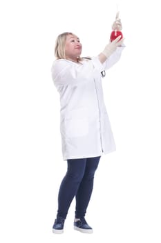 in full growth.smiling woman doctor with a laboratory flask . isolated on a white background.