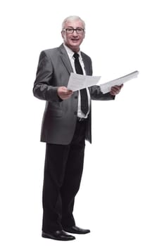 in full growth. Mature business man with a digital tablet. isolated on a white background.