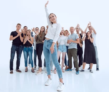 in full growth. affable young woman standing in front of a youth group. photo with copy space