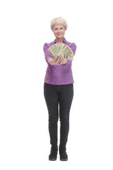 in full growth. happy mature woman with banknotes. isolated on a white background.