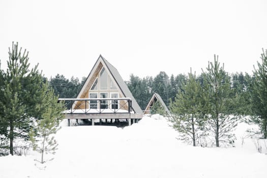 A country house in nature in winter. Rest in an ecologically clean place in winter. Glamping in nature