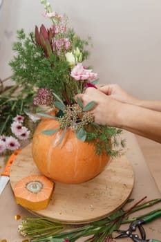 Creating a floral composition in a pumpkin. Making decor with your own hands