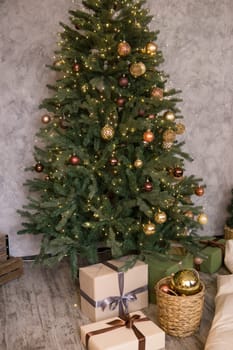Home New Year's interior. Christmas tree with gifts, decorated with garlands. Cozy atmosphere of a home holiday, loft design of the room, Scandinavian style
