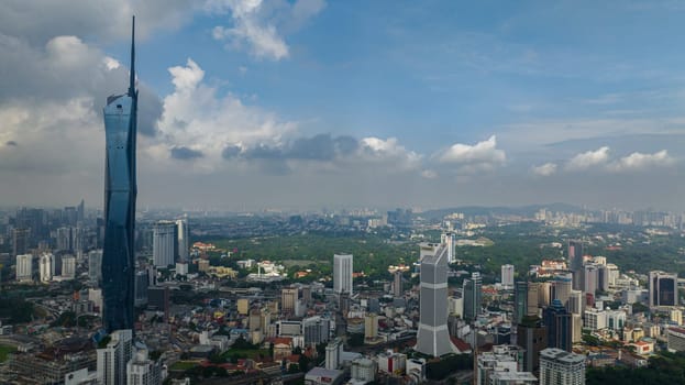 Kuala Lumpur, Malaysia - September 11, 2022: Aerial view of business district of Kuala Lumpur with skyscrapers and modern buildings. Merdeka Tower.