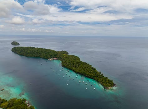 Aerial view of Rubiah island with jungle and blue sea. Aceh, Indonesia.
