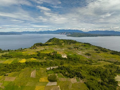 Aerial view of lake Toba and agricultural land in the countryside in the highlands. Sumatra, Indonesia.