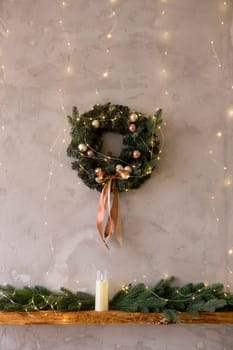 Home New Year's kitchen interior. Decorations with garlands and a Christmas wreath. Cozy atmosphere of a home holiday, loft-style interior design,