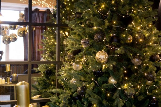 Balls on the Christmas tree close-up. Christmas tree design decorations. The concept of celebrating New Year and Christmas