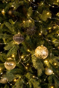 Balls on the Christmas tree close-up. Christmas tree design decorations. The concept of celebrating New Year and Christmas