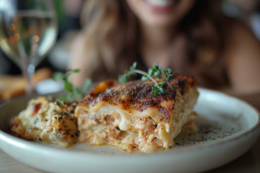 Delicious homemade lasagna dish with cheese and herbs served on a pasta plate