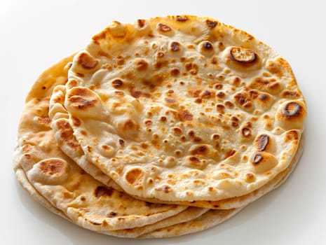 Delicious crispy golden round baked flatbread naan bread for a savory Indian dinner cuisine meal