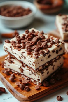 Delicious stacked white chocolate bar with rich chocolate chips on a wooden table