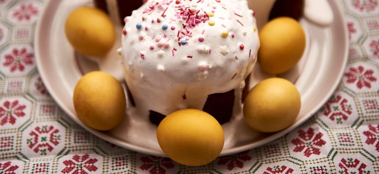 Easter cakes and eggs for the holiday. Holy Easter. Golden eggs laid out on a platter.