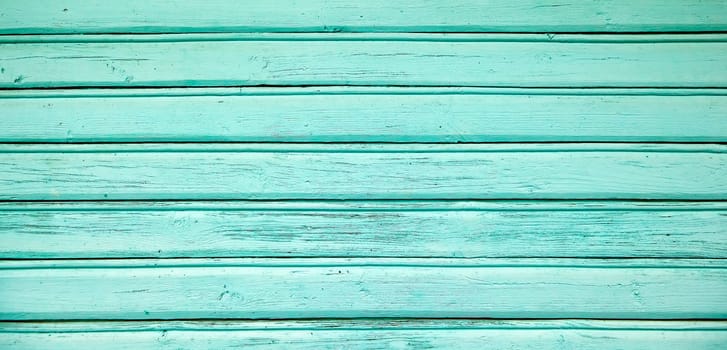 wood trim home turquoise background image, vintage, turquoise wood veneer, in daylight.