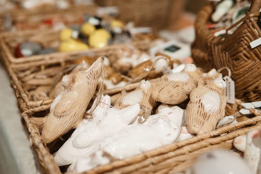 Sale of handmade ceramic Christmas tree toys at the Christmas Fair. Black Friday for the winter holidays