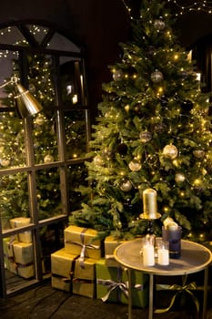 Christmas interior with a beautiful Christmas tree, light bulbs and dark background