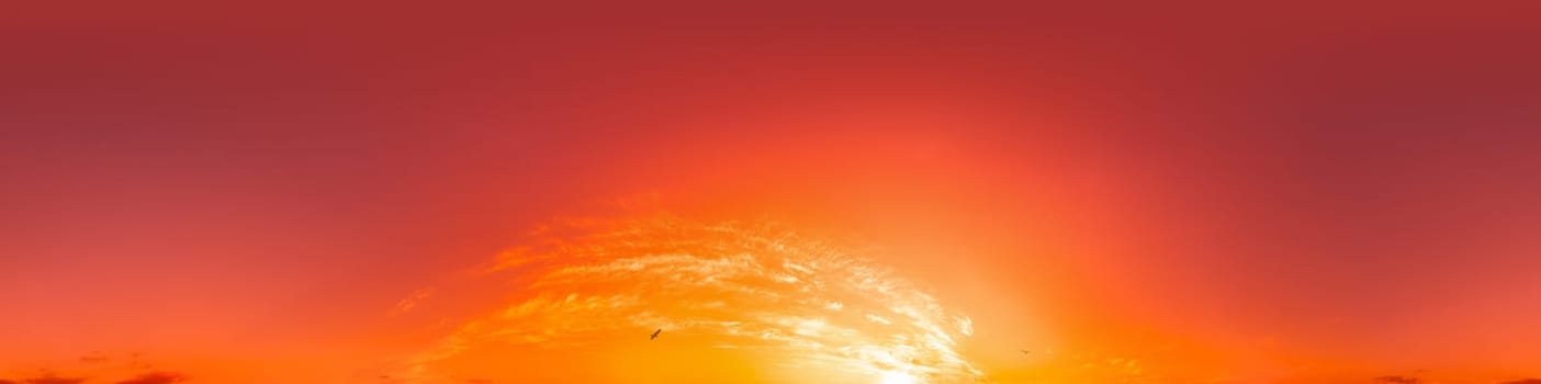 Dramatic Sunset sky 360 panorama. Vibrant sky with bright glowing red pink Cumulus clouds. HDR 360 seamless spherical panorama. Sky dome for aerial drone panoramas. Climate and weather change