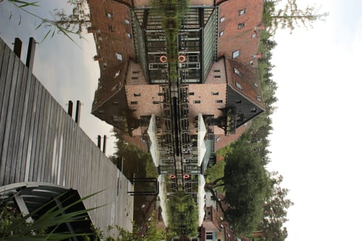 View of a residential building with a cafe-restaurant by the river in the forest. High quality photo