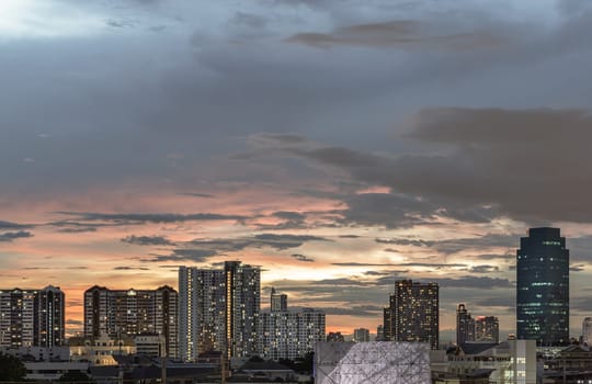 Bangkok, Thailand - 15 Aug 2024 - Night city view of Dramatic sky over Large Metropolitan after sunset. Stunning At Twilight skyline of bangkok business district with Skyscrapers use it as your wallpaper, poster and banner design, Copy space, Selective focus.