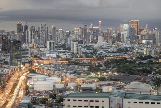 Bangkok, Thailand - 15 Aug 2024 - Bangkok city skyscrapers after sunset with Dramatic sky background before Sunset. View of Beautiful Clouds in the Sky over Large Metropolitan City, Copy space, Selective focus.