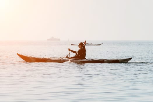 Happy smiling woman in kayak on ocean, paddling with wooden oar. Calm sea water and horizon in background