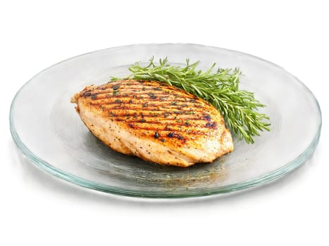 Grilled chicken breast with herbs juicy and tender on a simple transparent glass plate clean. Food isolated on transparent background.