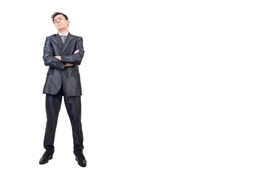Full body of over proud male in formal suit looking at camera with crossed arms isolated on white background in studio