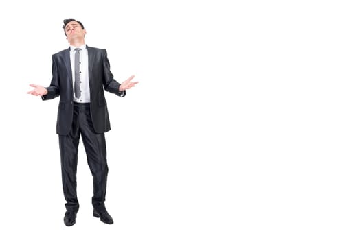 Full body of trusted businessman in elegant suit looking at camera with palms up isolated on white background in light studio