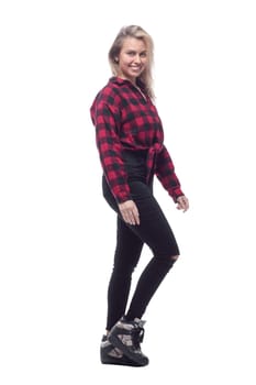 side view. cheerful young woman in a checked shirt looking at you. isolated on a white background.