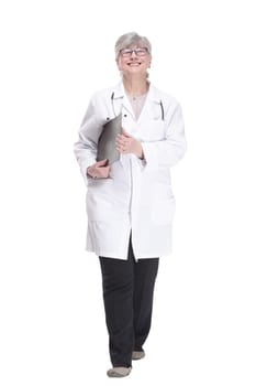 in full growth.confident female medic with clipboard looking at you. isolated on white background.